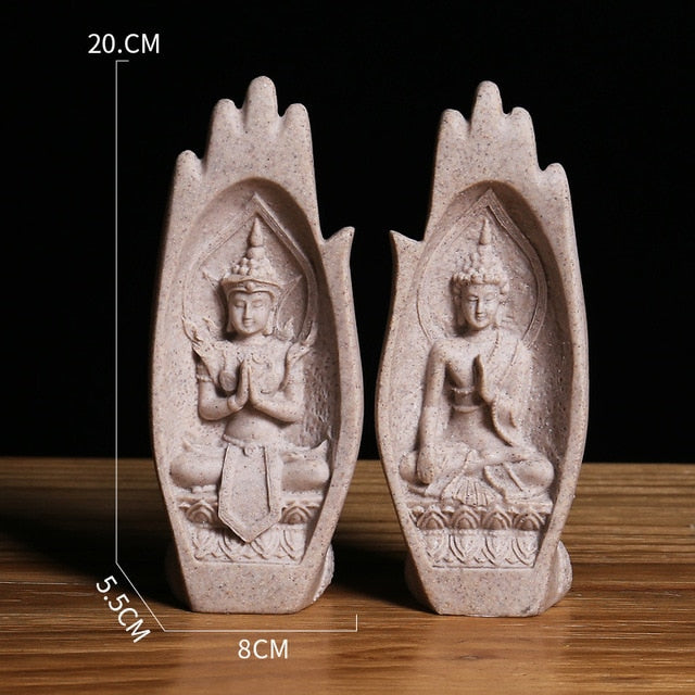 Antique-colored resin praying hands with Buddha inside